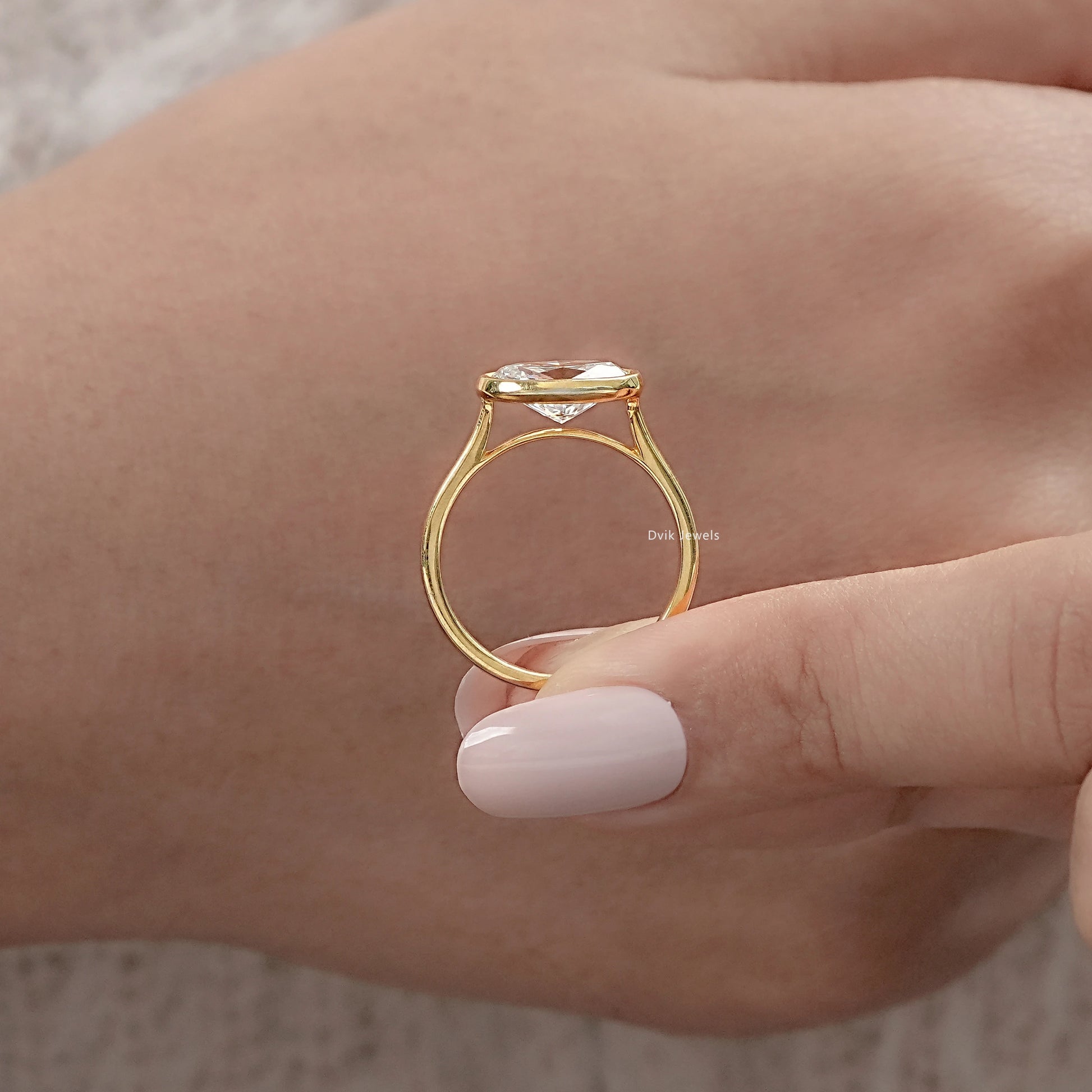 Oval East-West Bezel Engagement Ring Ring