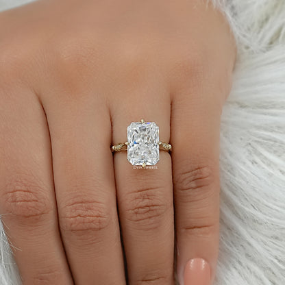 Radiant cut diamond ring worn on the finger of the hand