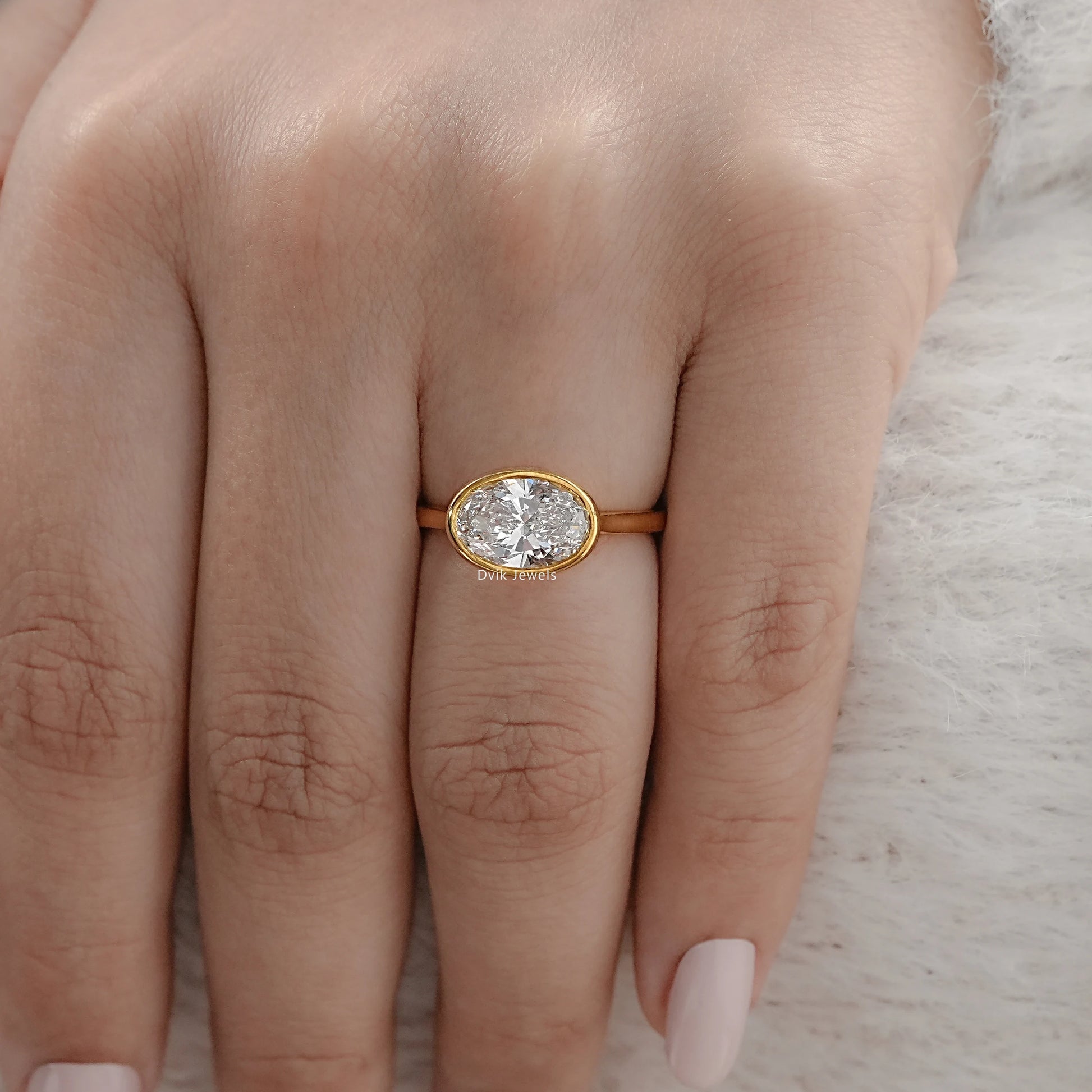 Oval East-West Bezel Engagement Ring Ring