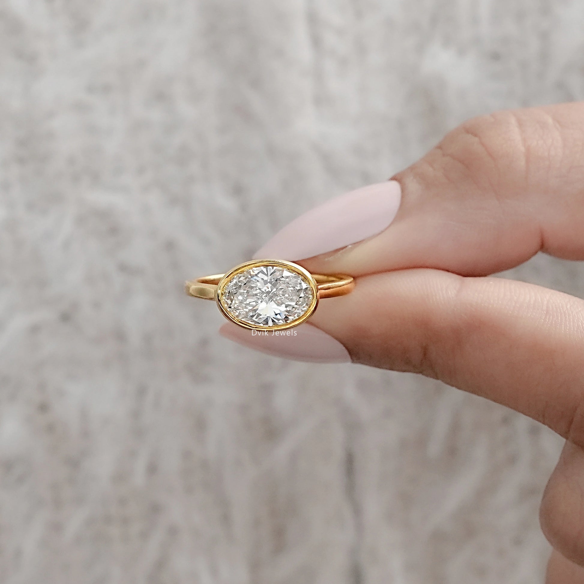 Oval East-West Bezel Engagement Ring Ring