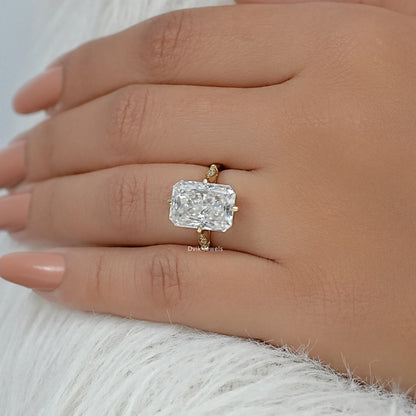 lab grown radiant cut diamond engagement rings worn on a finger.