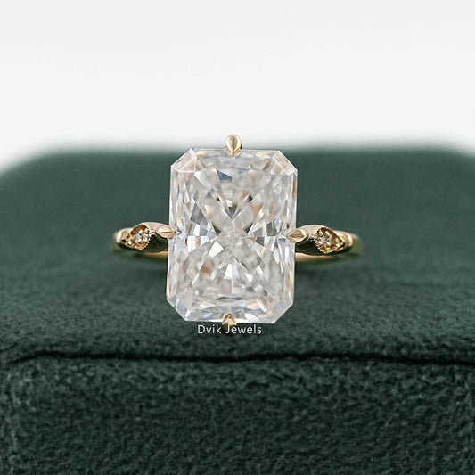Radiant Cut Solitaire Ring in yellow gold on a green velvet box.