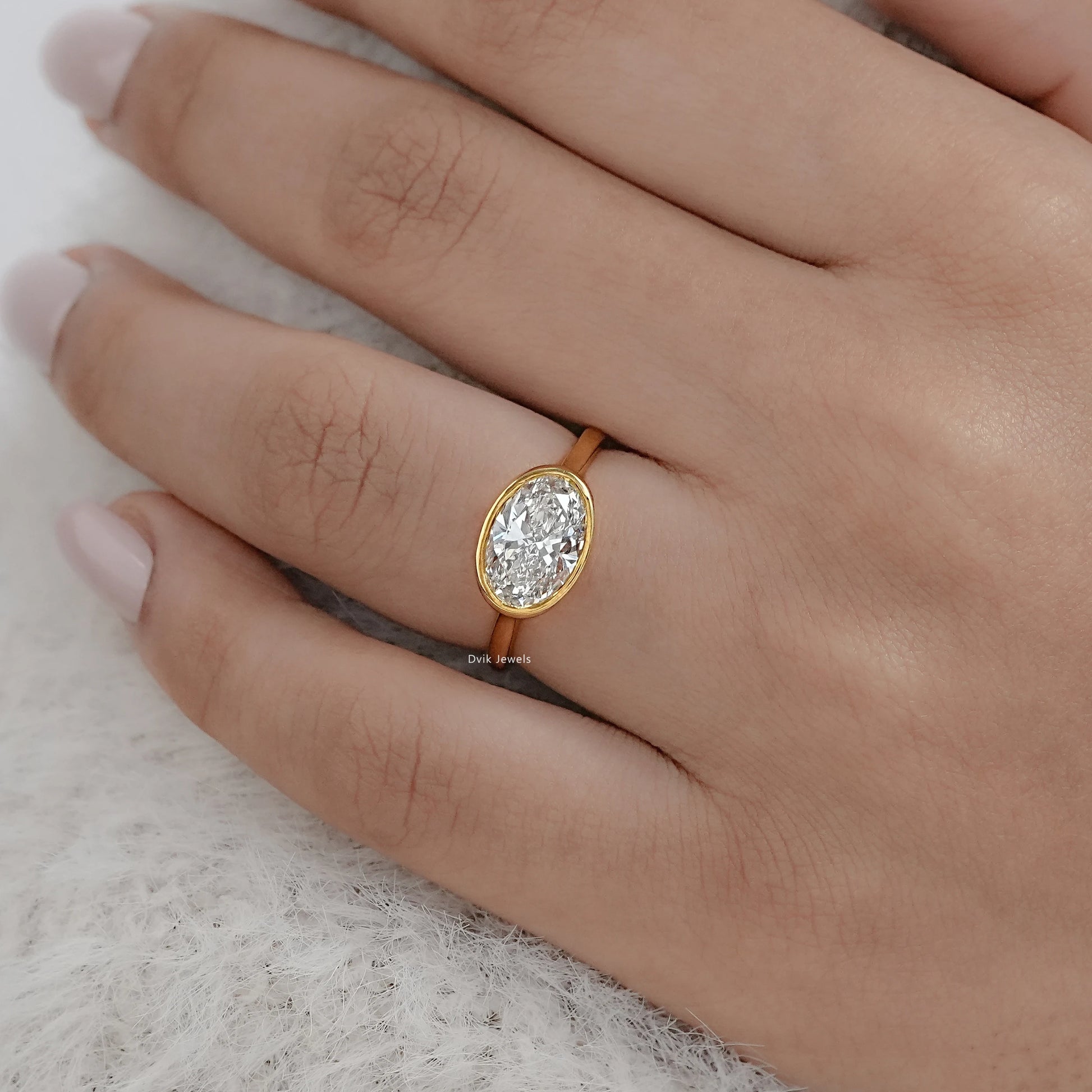 Oval East-West Bezel Engagement Ring Ring
